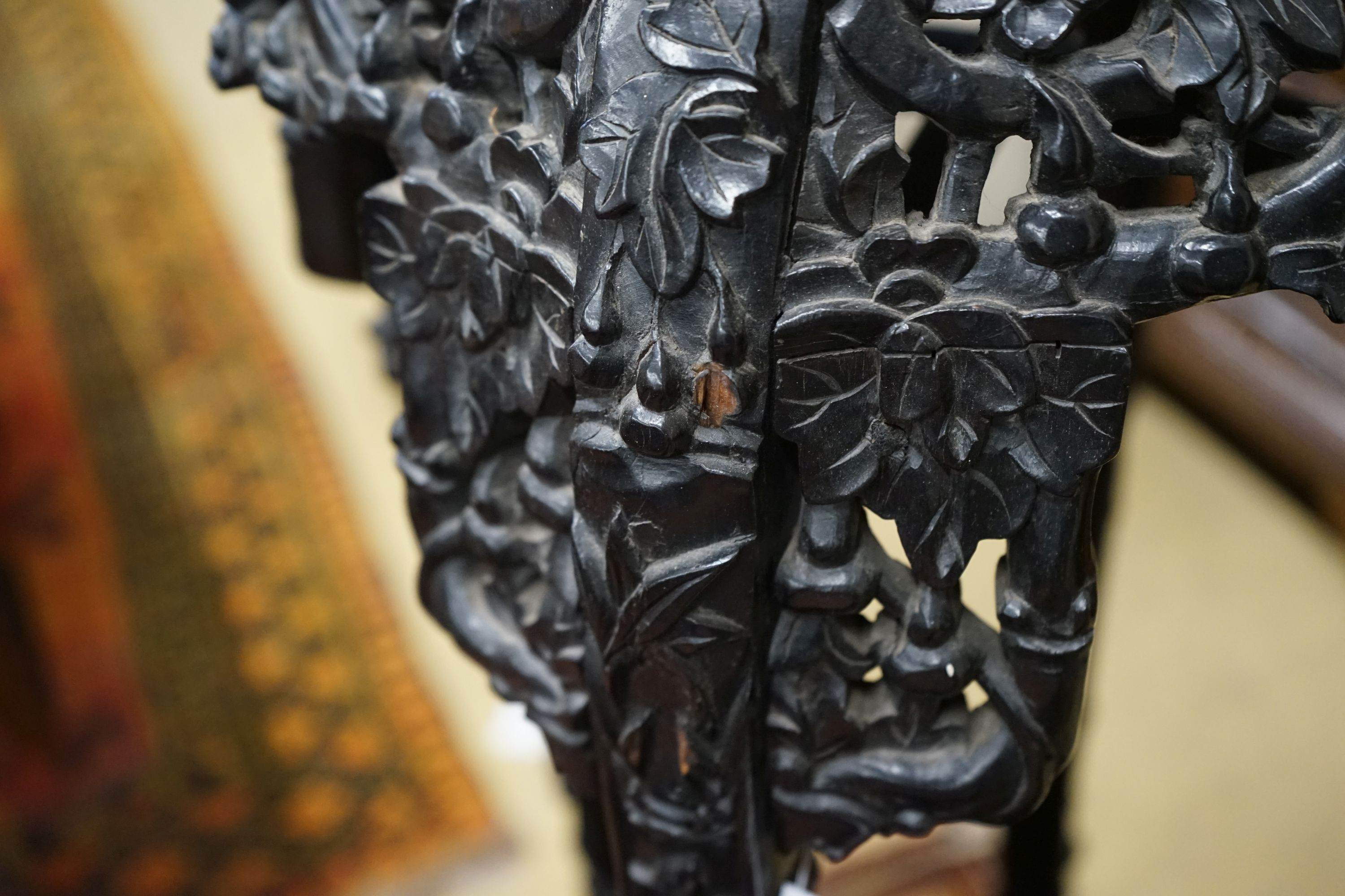 A Chinese carved hardwood marble top octagonal vase stand, width 40cm, height 90cm